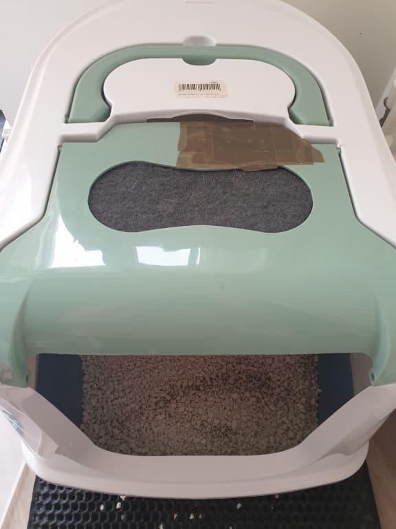 Lid taped up to stop cats hurting themselves on sharp edges