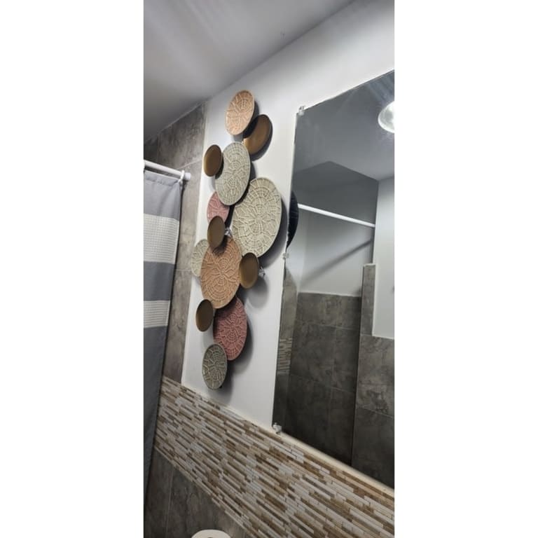 Stratton Home Decor Modern Pink and Gold Metal Plates Wall Decor Bed