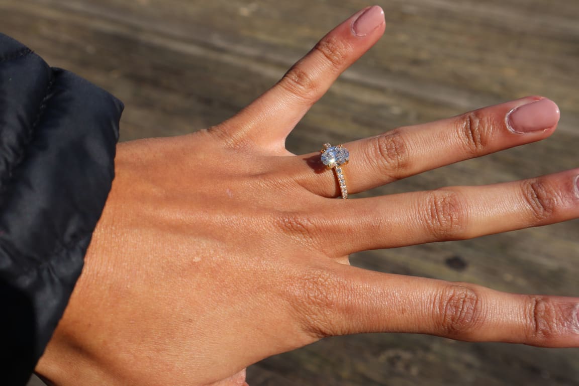 Oval diamond ring on hand