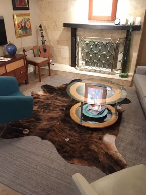 Customer Image Captioned: Note, the chairs have been pulled back to showcase this beautiful cowhide!