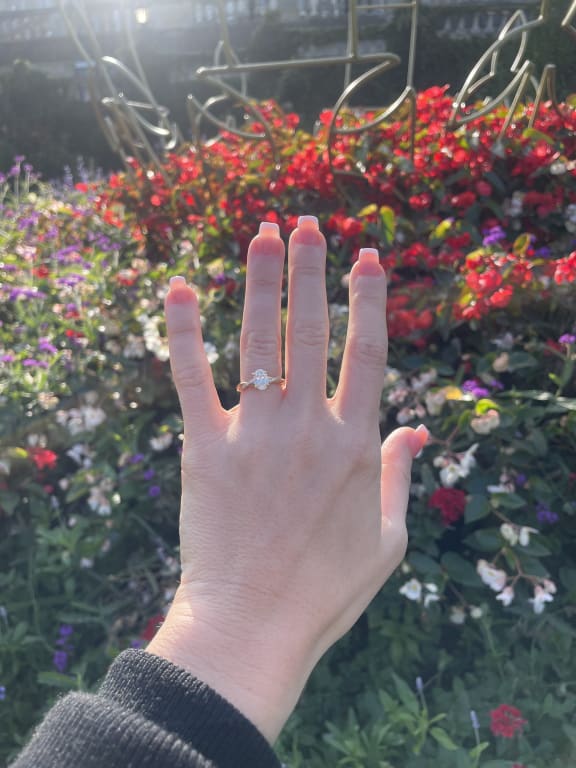 Oval diamond ring on hand