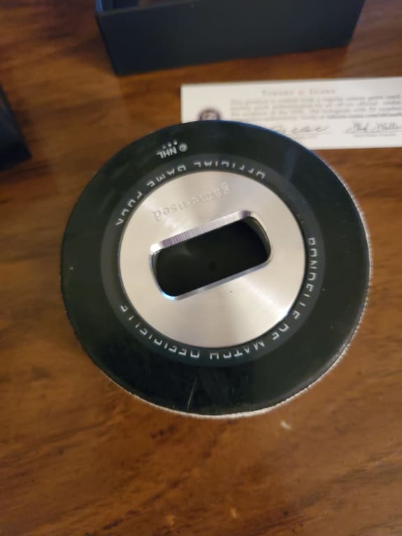 NHL Game Used Hockey Puck Opener from Uncommon Goods. Customer submitted image.