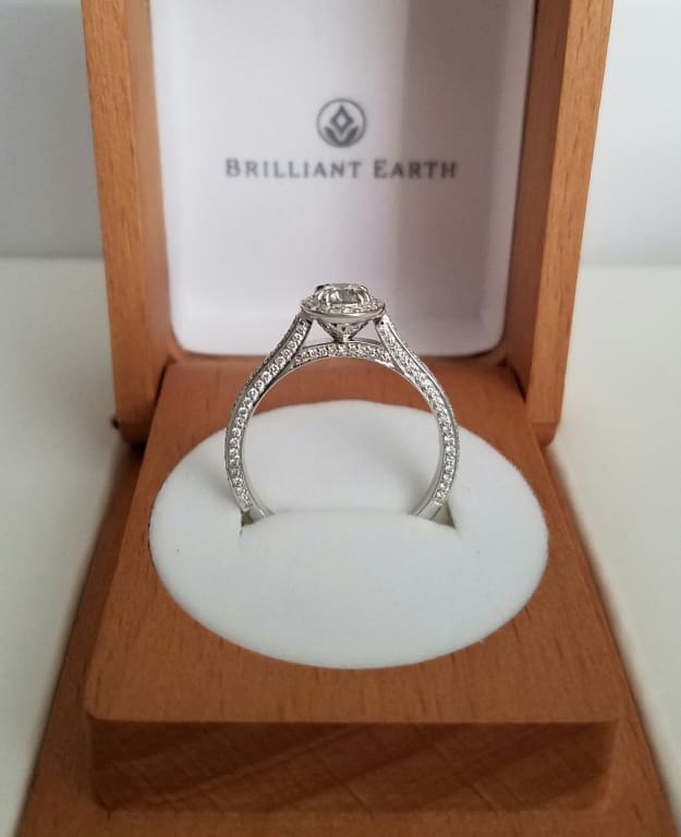 Oval diamond ring on hand