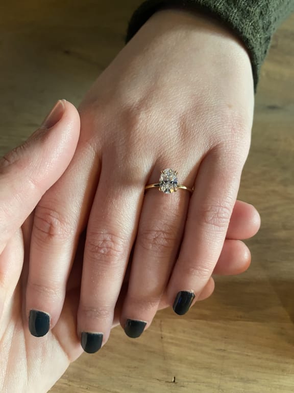 Oval diamond ring on hand