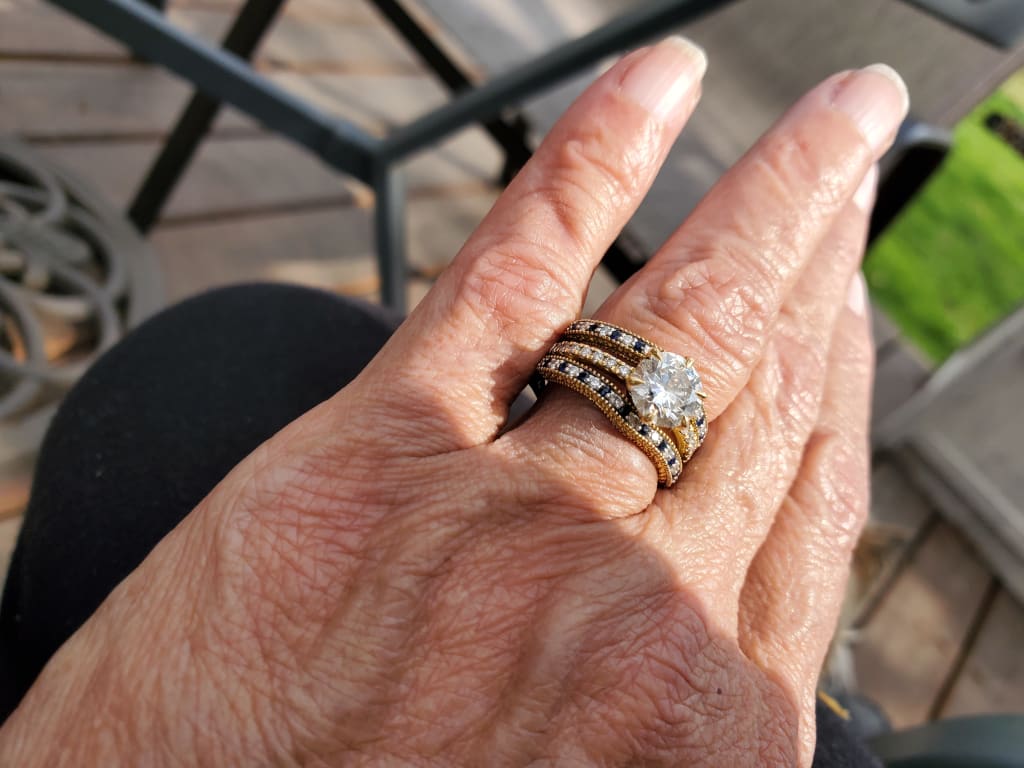 Oval diamond ring on hand