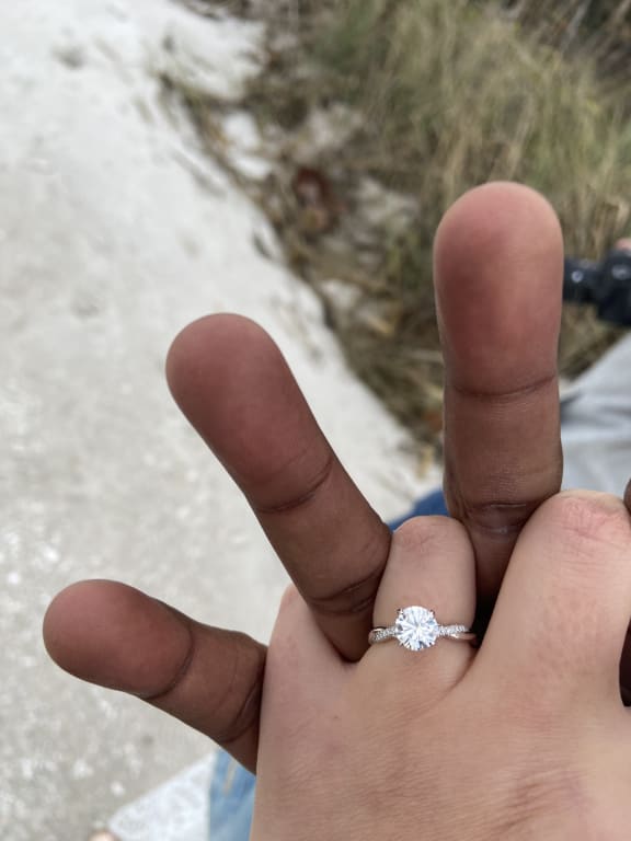 Oval diamond ring on hand