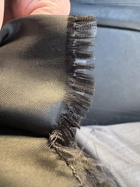 Customer Image Captioned: torn pocket seam