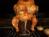 Smoked chicken using a beer can stand with glass jar instead of real beer can and the smoker box with wet chips smoker box