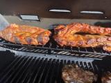 Pork ribs slow cooking on the top rack