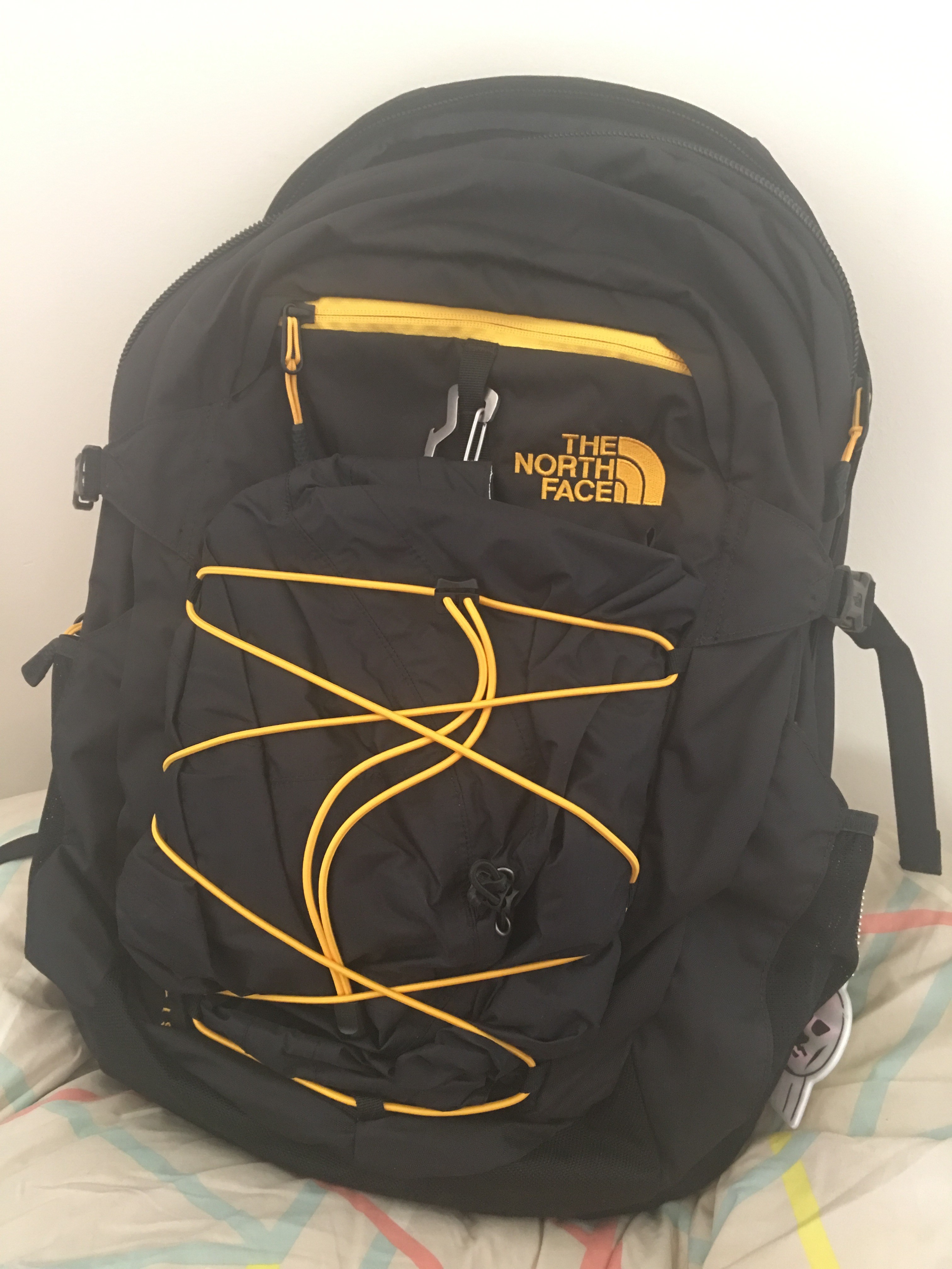 With my black raincoat in the bungies