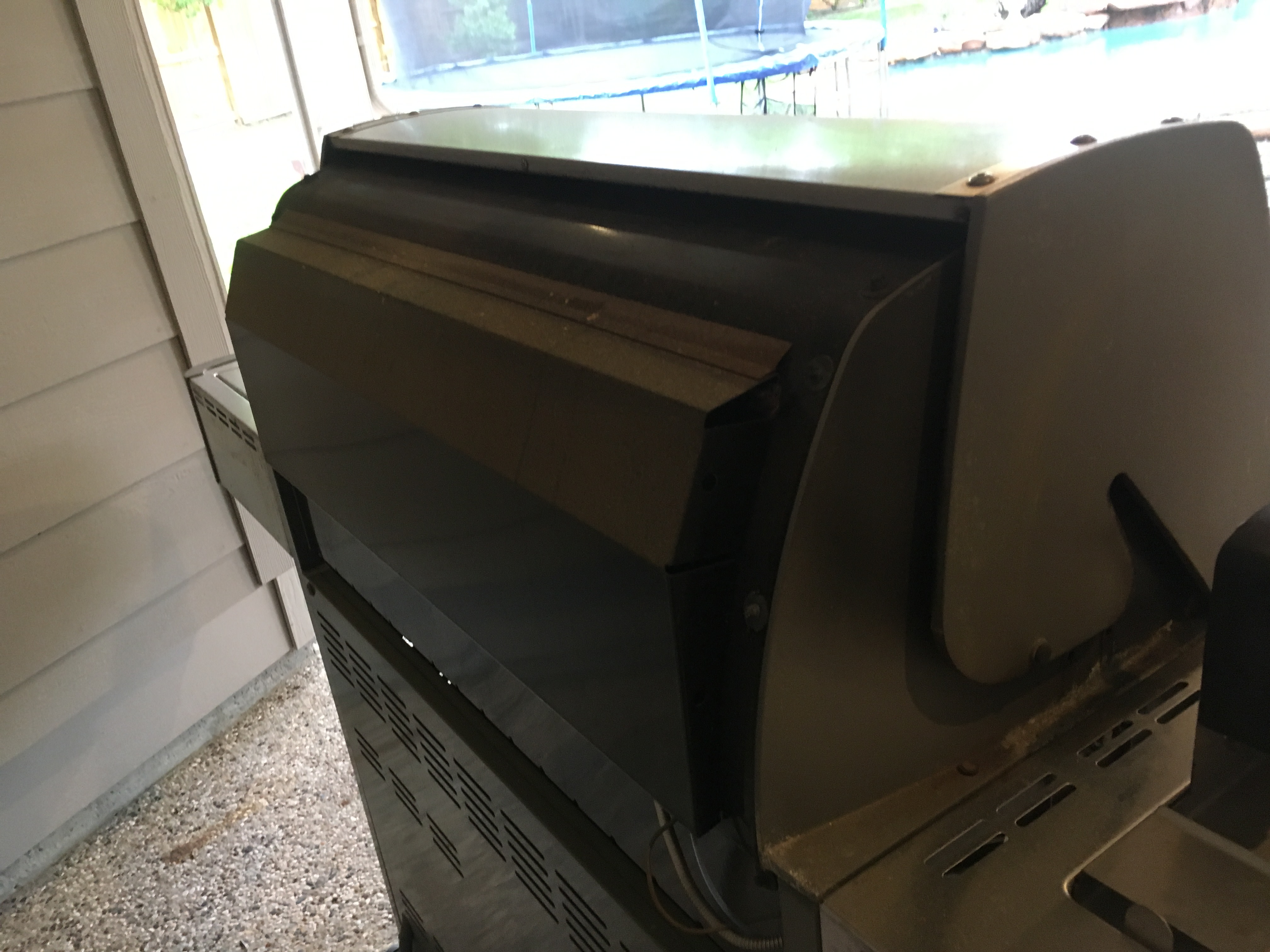 Back of the grill.  Note that the back of the cook box and the complete base is not stainless steel.