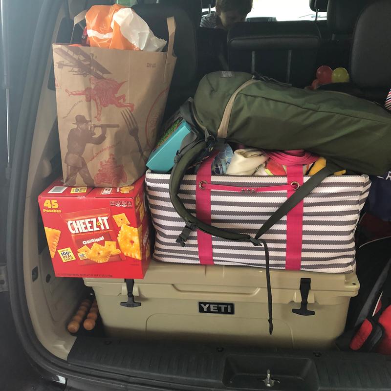 The yeti 105 in the cargo hatch of our minivan on vacation.