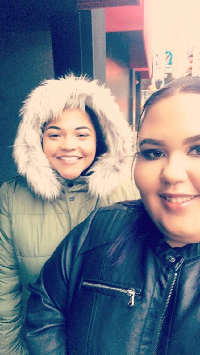 My daughter in her parka in the D ( Detroit )