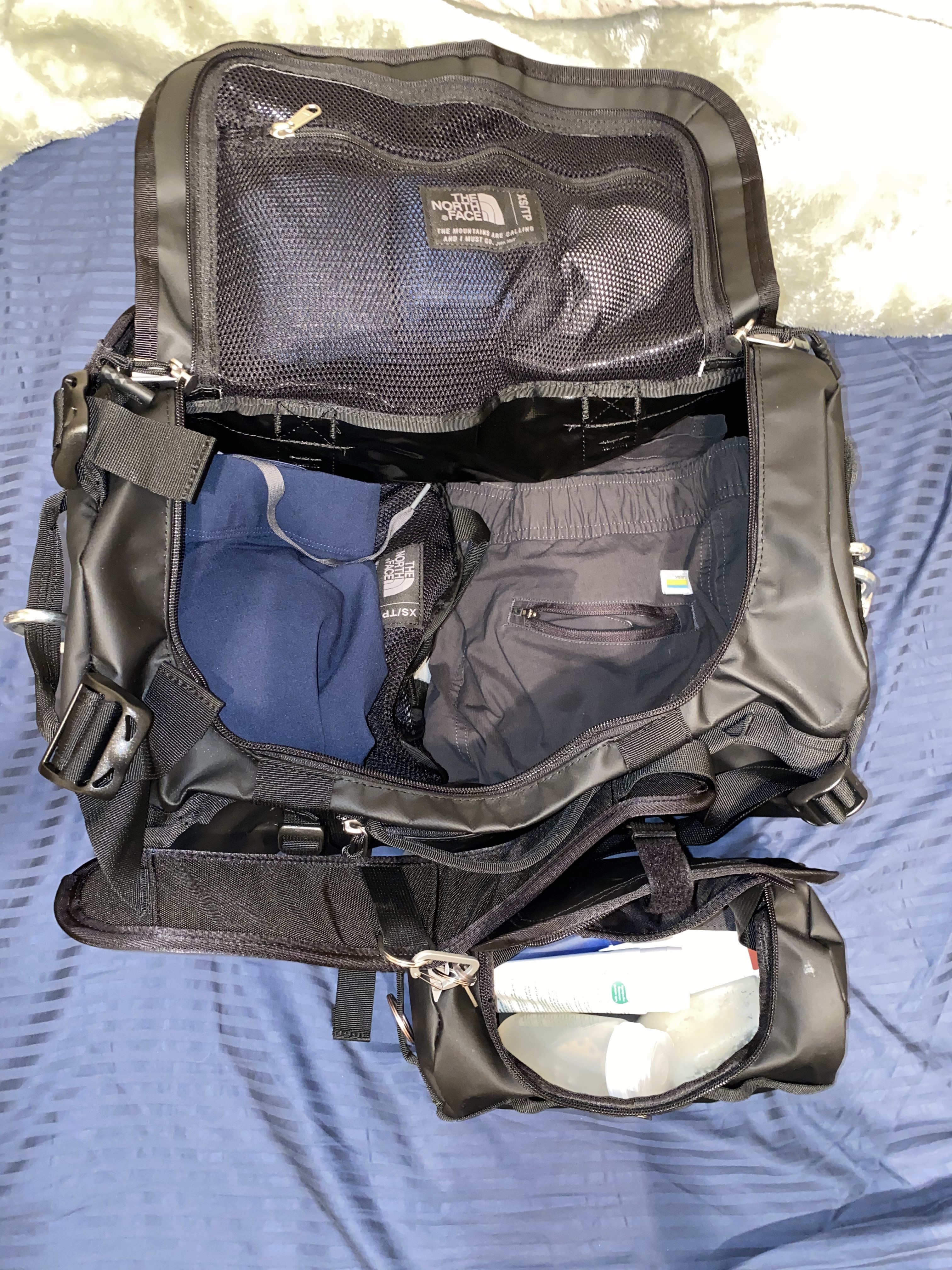 The duffel and the travel bag open