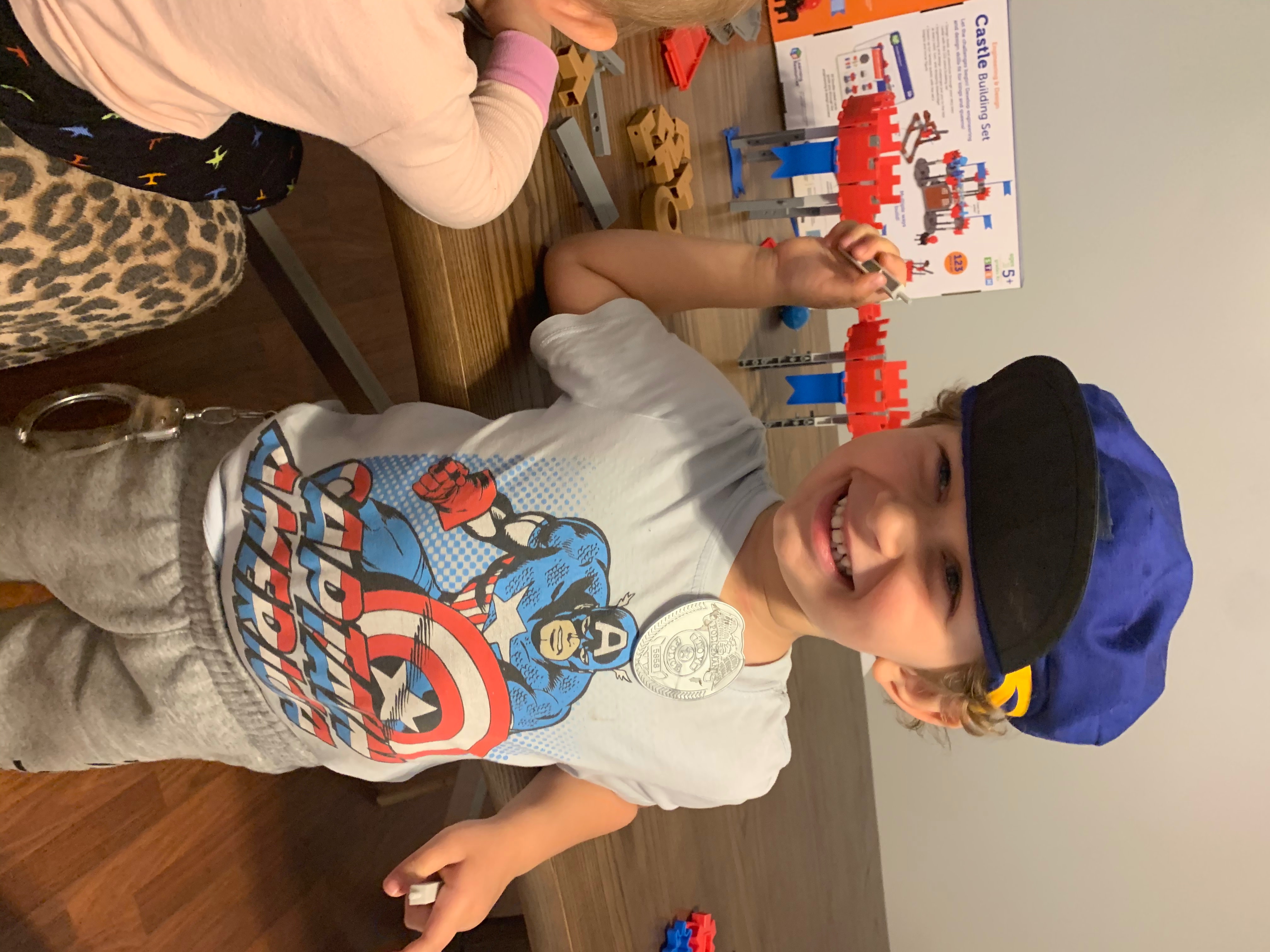 Remington and Everly playing with their new Engineering and Design Castle