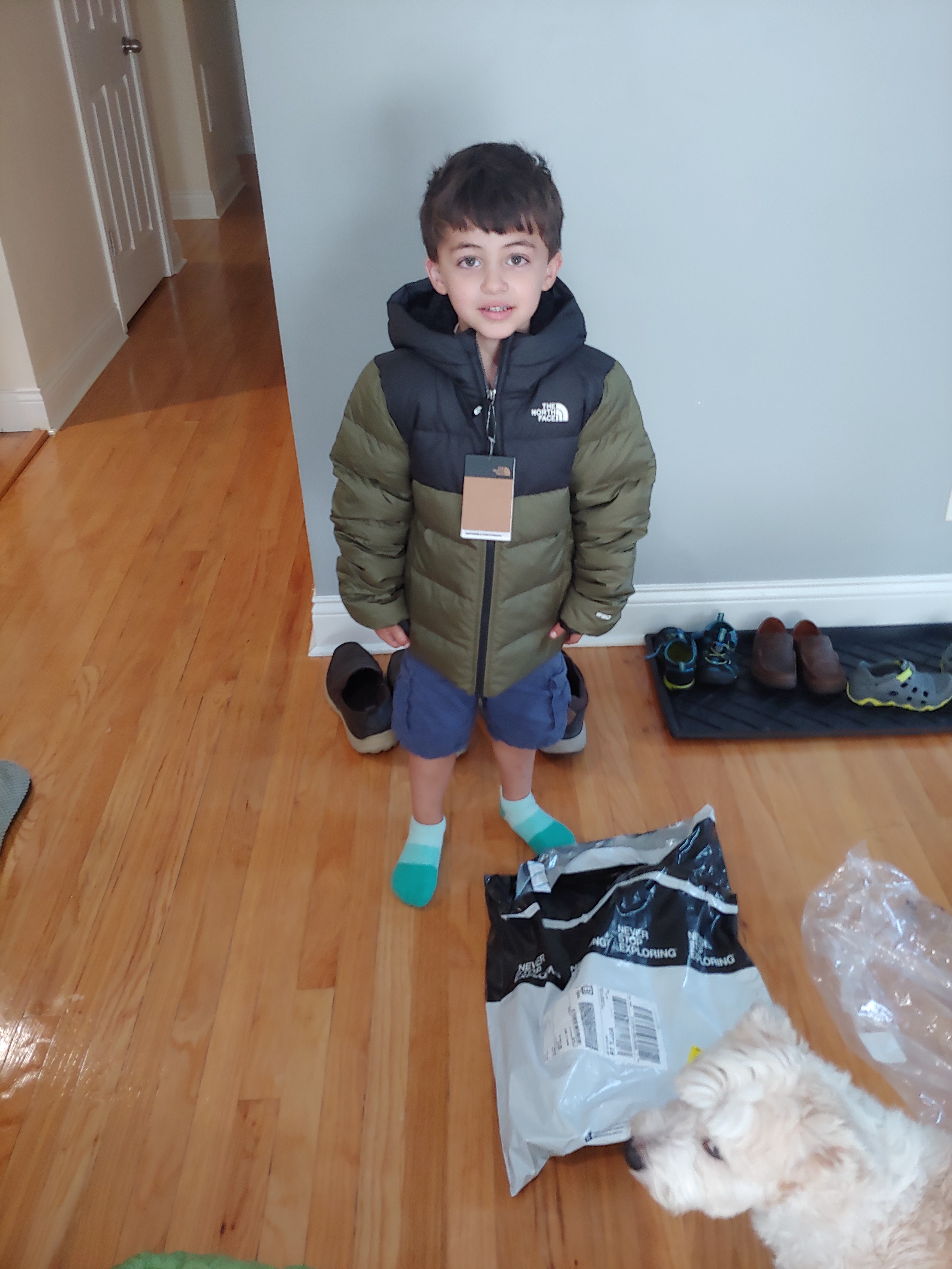 Trying his new coat on when it arrived.