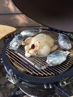 Whole chicken on the top grate.