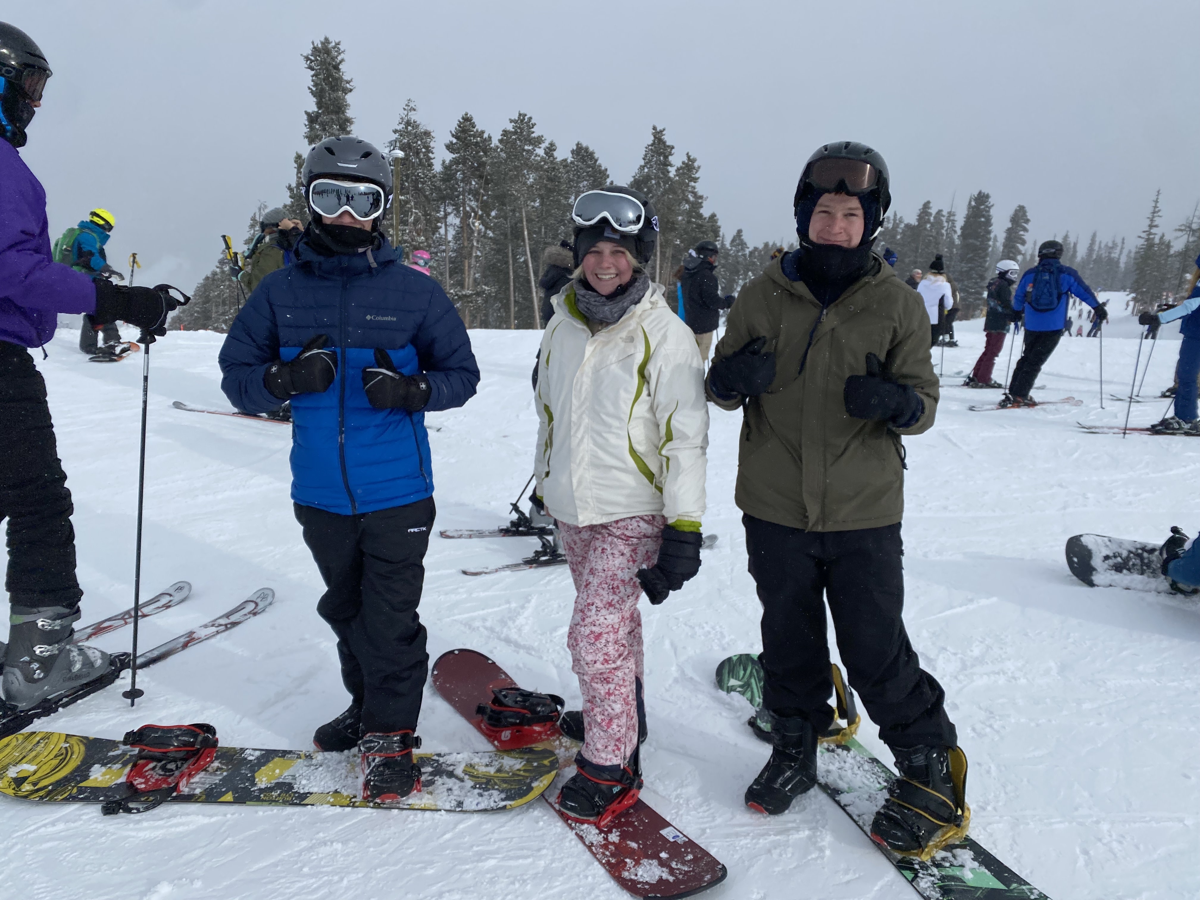 Ready for the slopes in his northface ski pants (right)