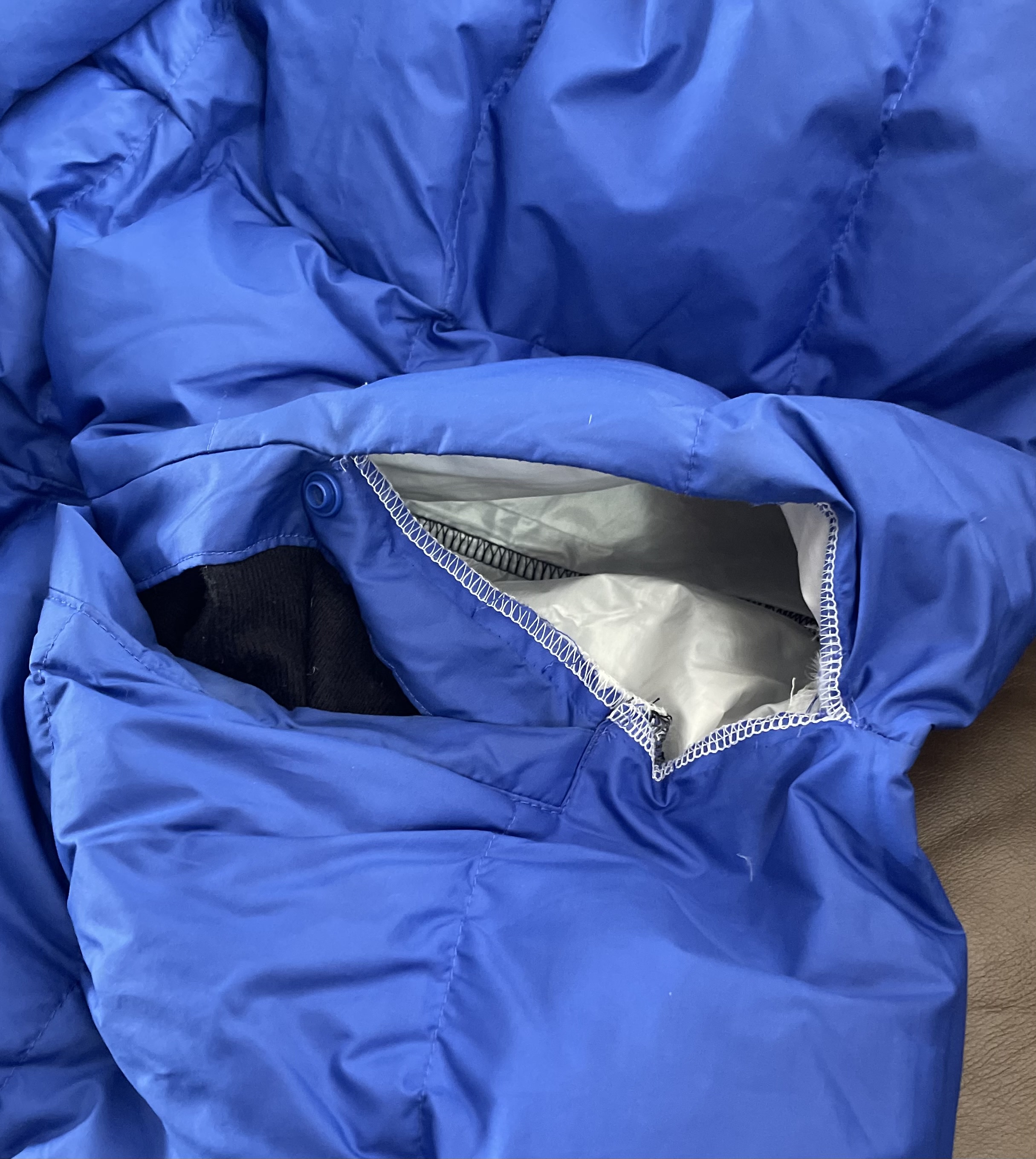 The hole in the seam by the pocket.