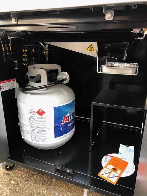 Underneath storage and hanging propane tank