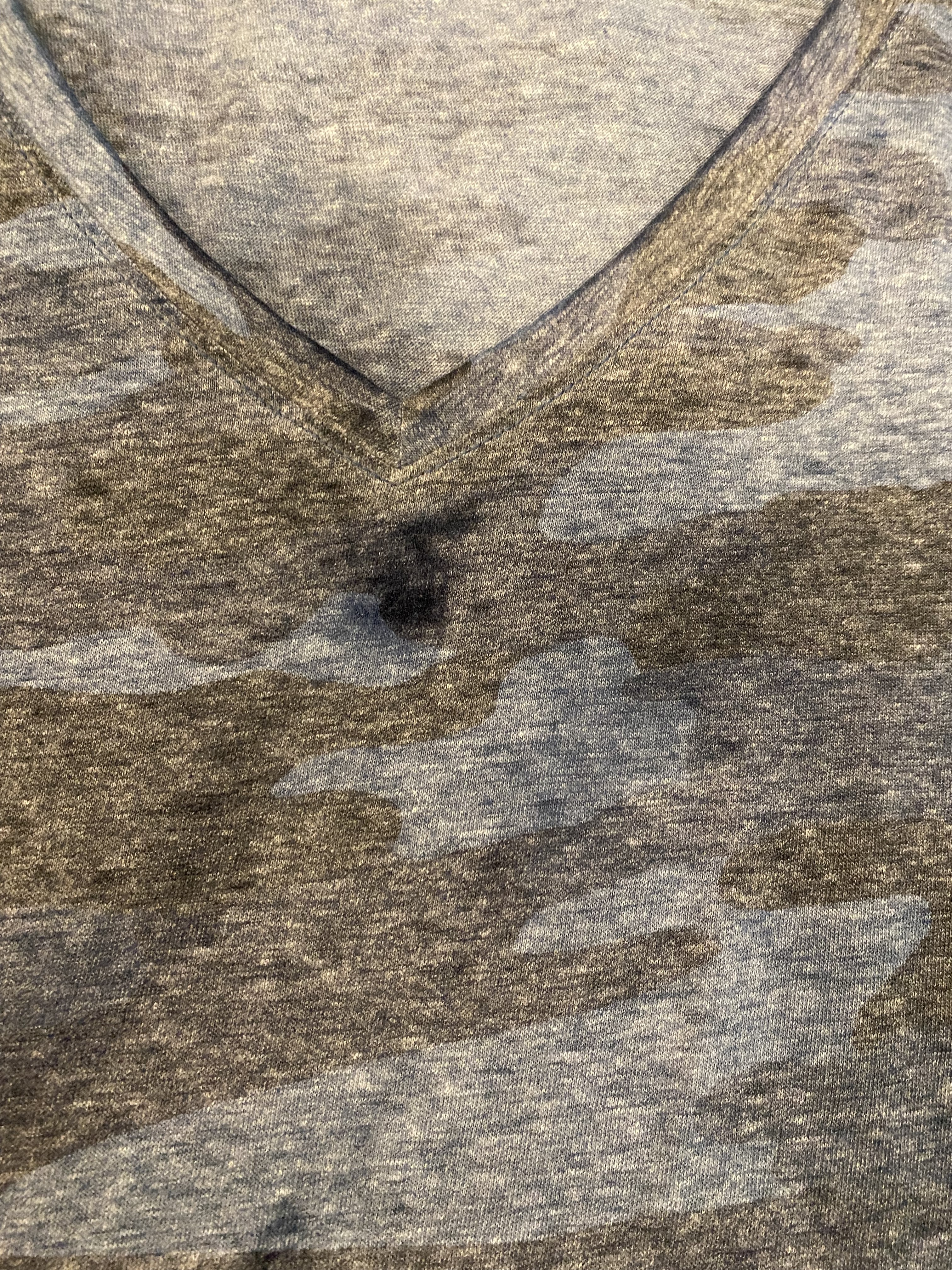 Not a spot. The fabric has worn away where it looks darker.