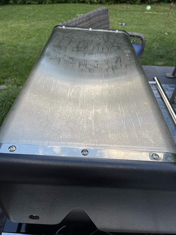 Adhesive on grill top