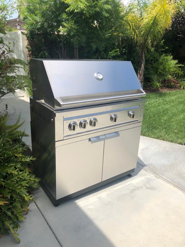 Cabinet with doors closed and installed grill