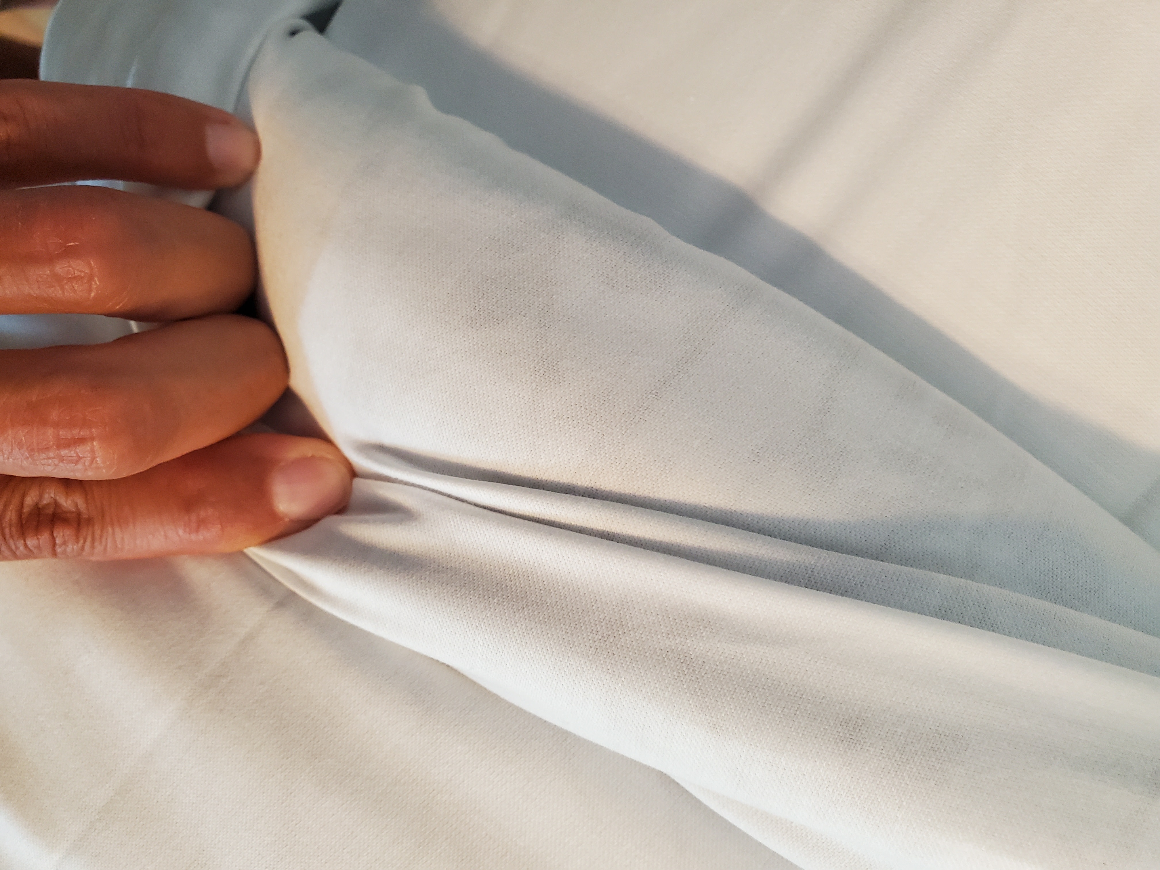 Here you can see the comforter pattern through the folded back sheets