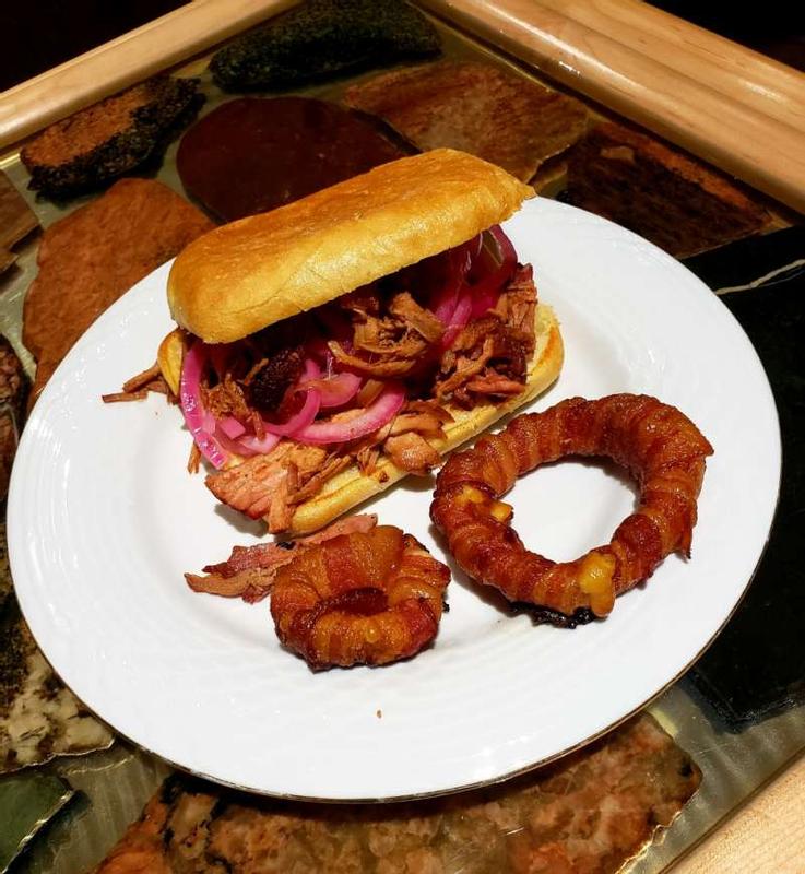 Pulled pork with bacon wrapped onion rings.