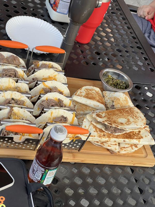Looks great, cooks great! The griddle locks into the top which is awesome. The sides have wind blockers and there are magnetic tool holders in each shelf. The storage, slide out propane tank shelf, trash bag holder and paper towel holder are all awesome.