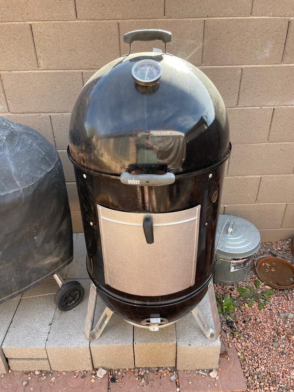You can see here where the lid fits inside the body.  if it sat on the outside like the Kettle grill, water would not accumulate inside of the smoker.