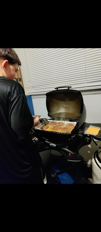 My 11 year old son grilling on his Weber Q1200