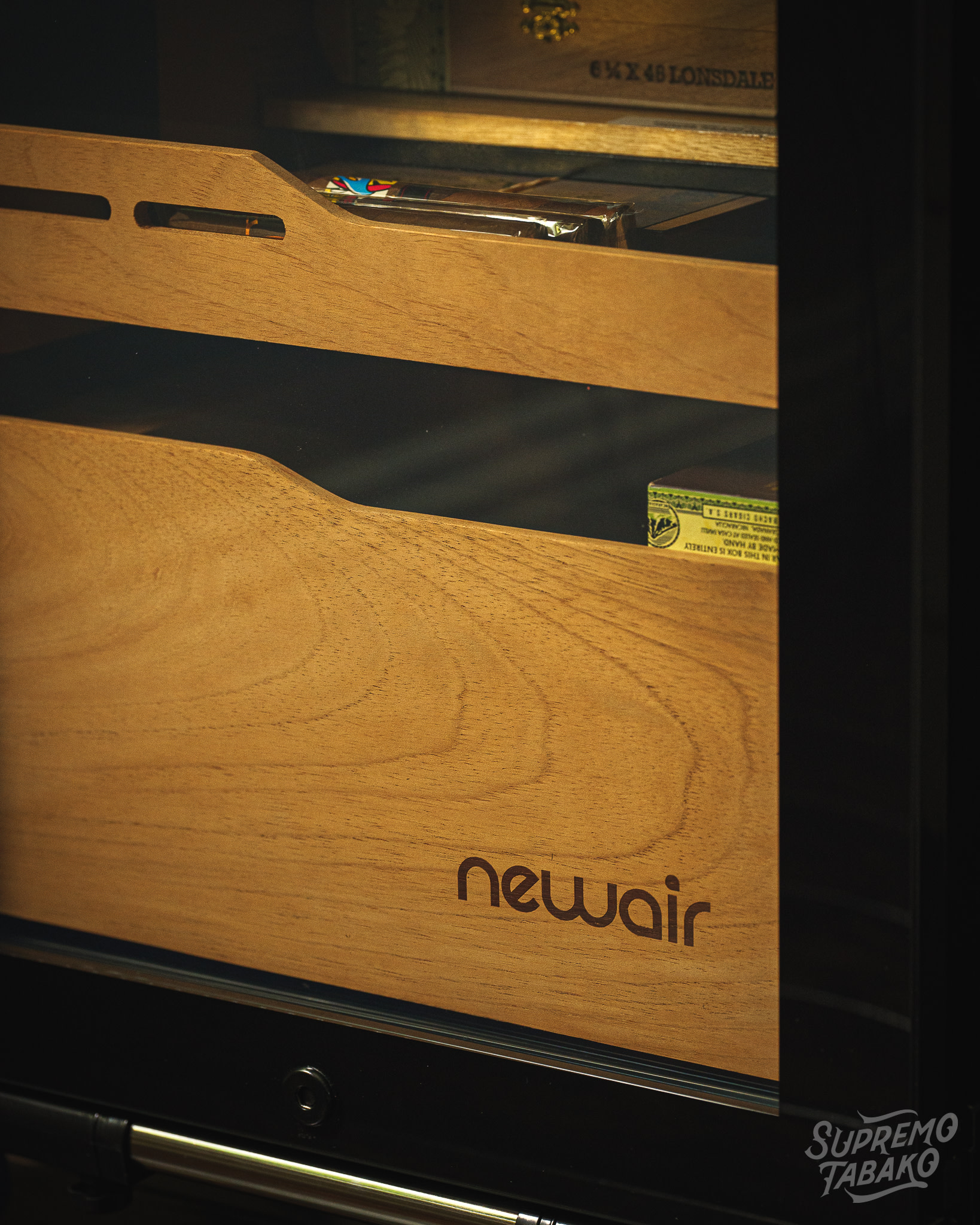 The cubby is perfect for smaller cigar boxes or tins of pipe tobacco