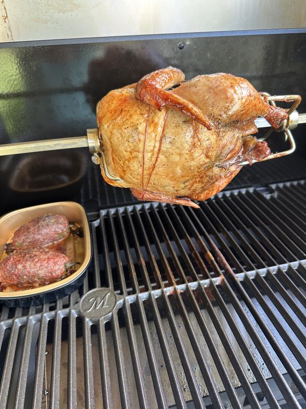 One chicken on the rotisserie and a couple of brisket stuffed jalapeño peppers.