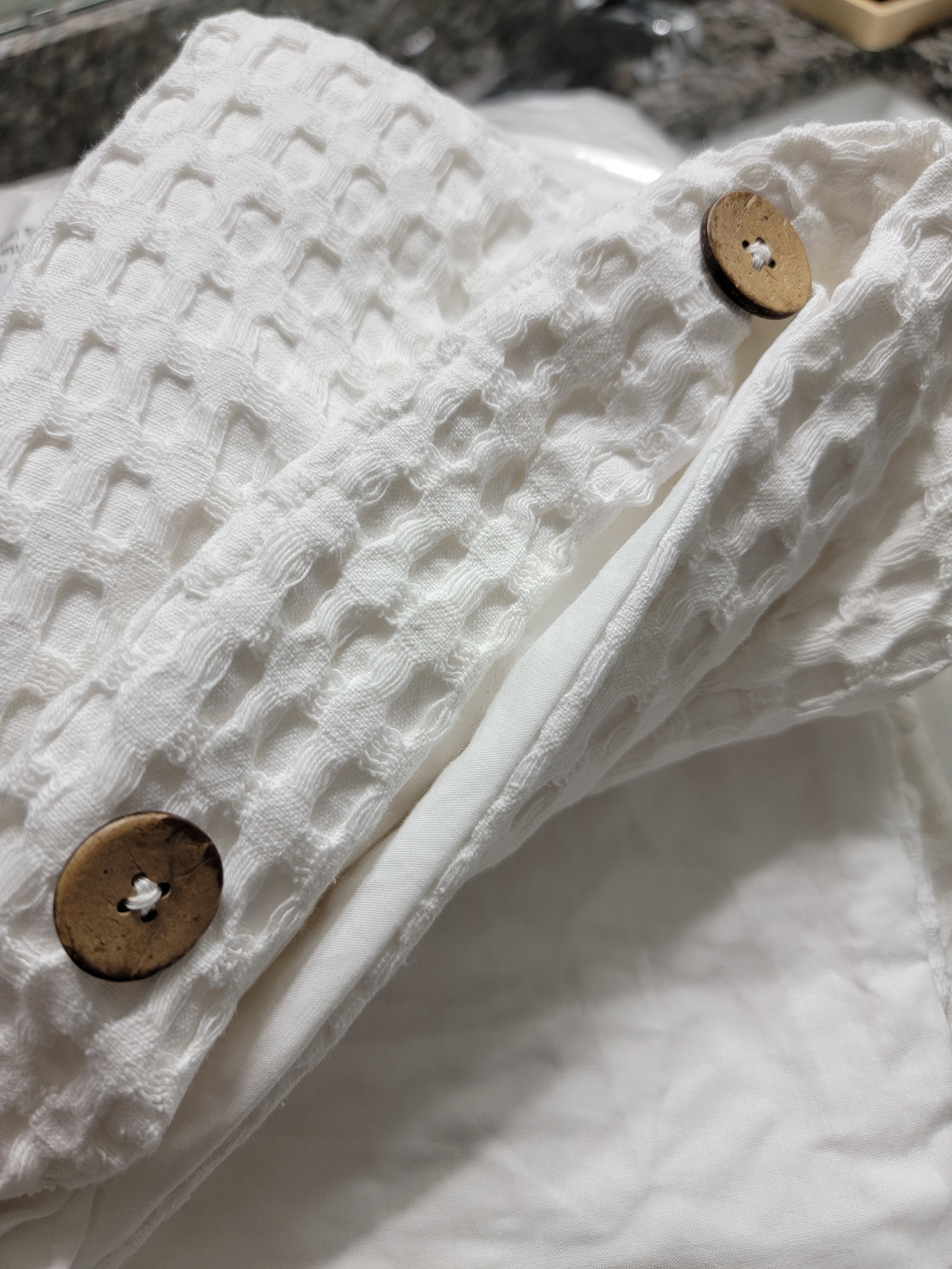 Button closures and waffle detail