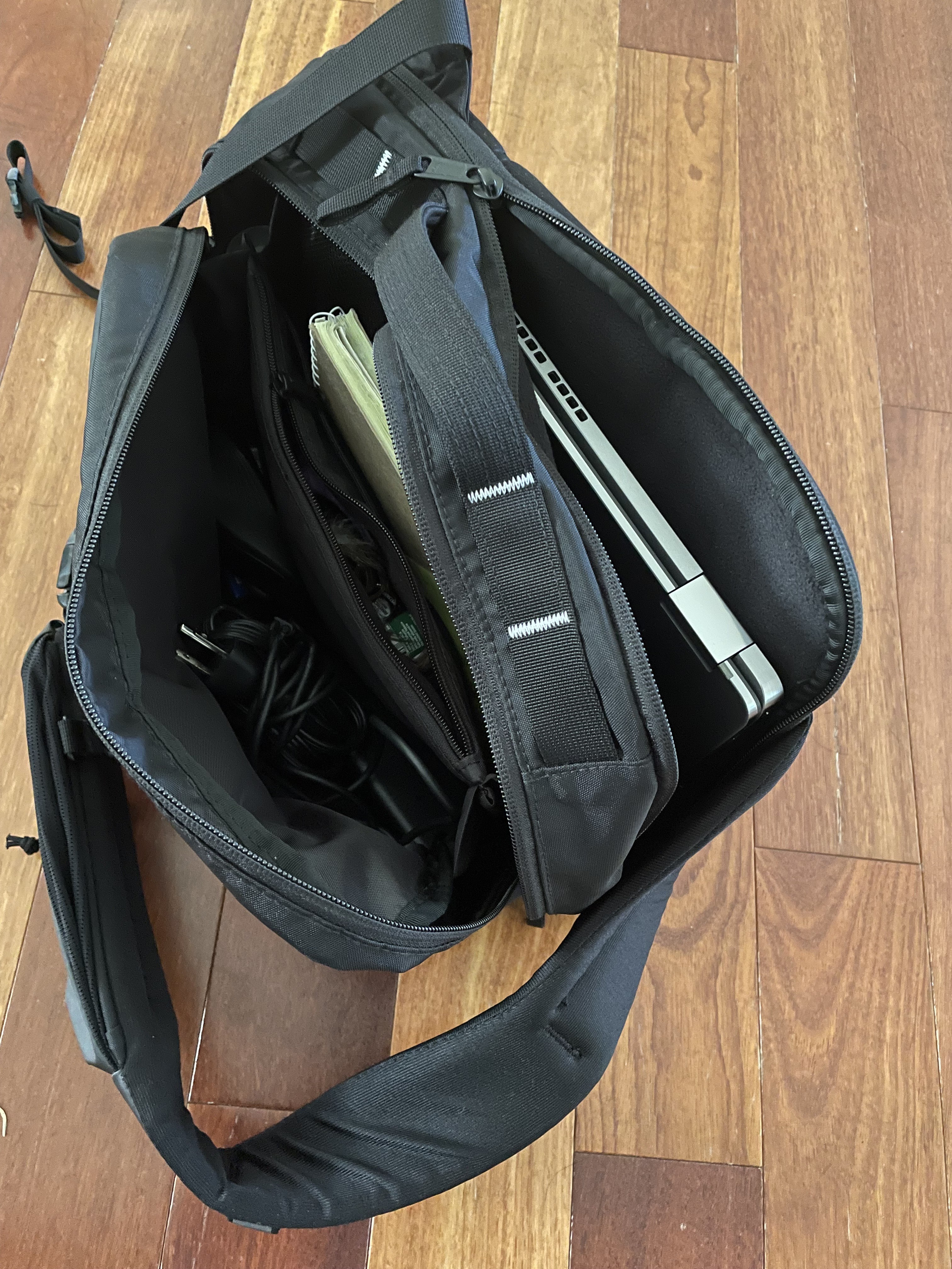 Laptoo, note pads, charger, and personal items