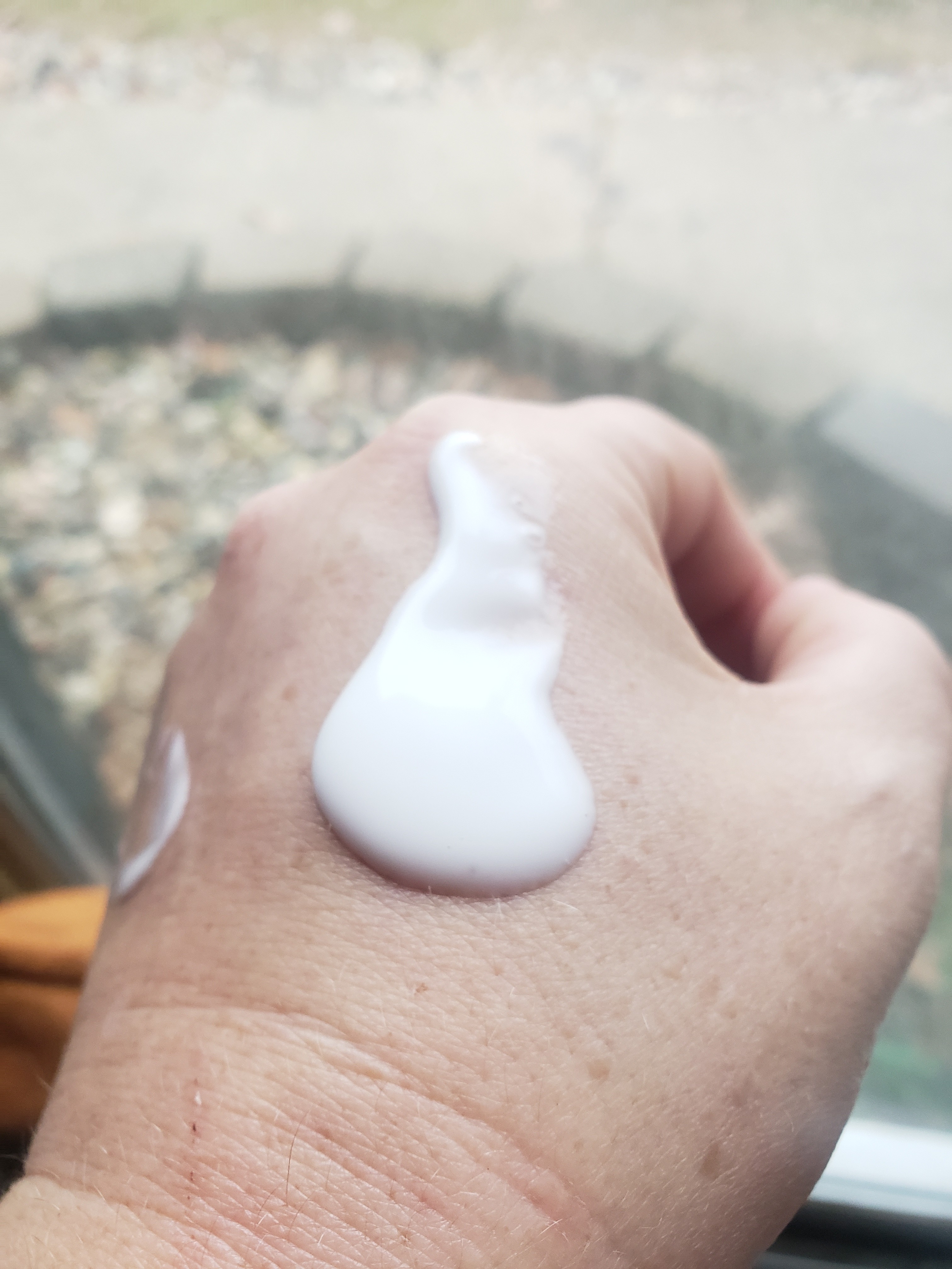 Milky texture, spreads easily.