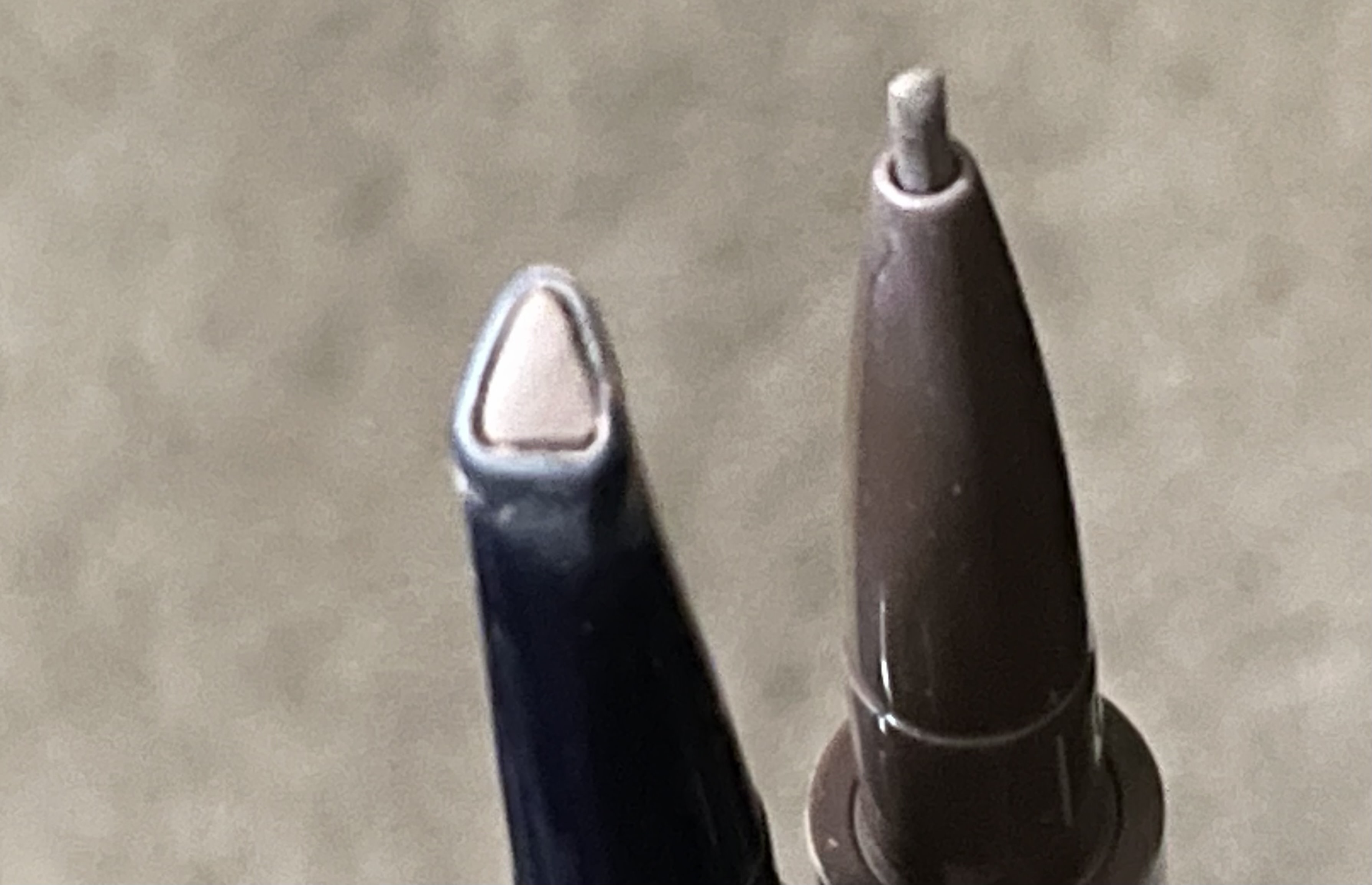 Left is discontinued brow pencil. Right is the new garbage pencil that breaks with each stroke.