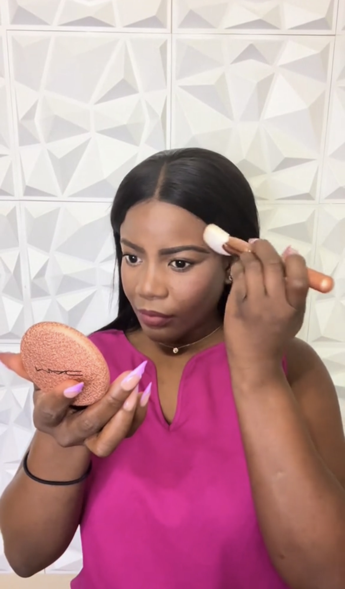 Applying bronzer with brush