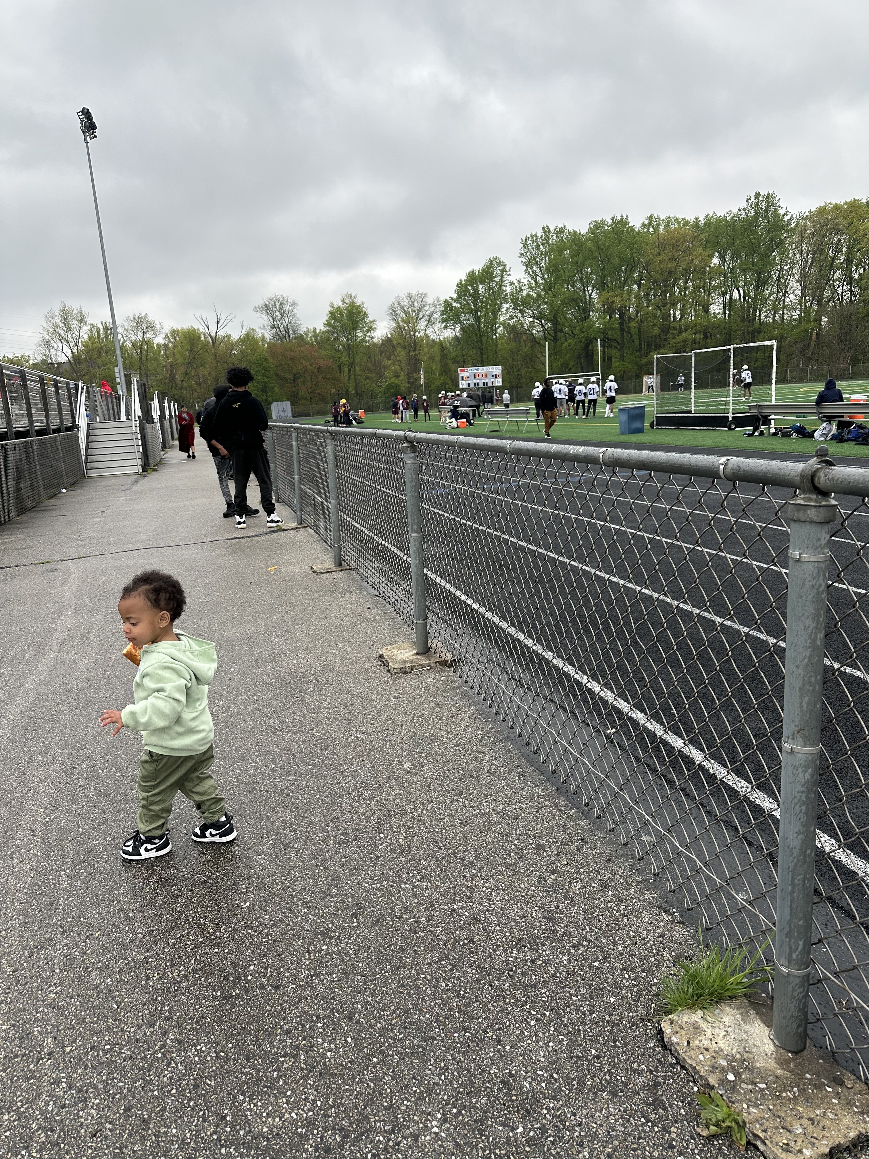 Nova out on a rainy day at her brothers high school lacrosse game!