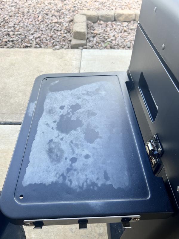 Shelf is faded and is covered and under porch.