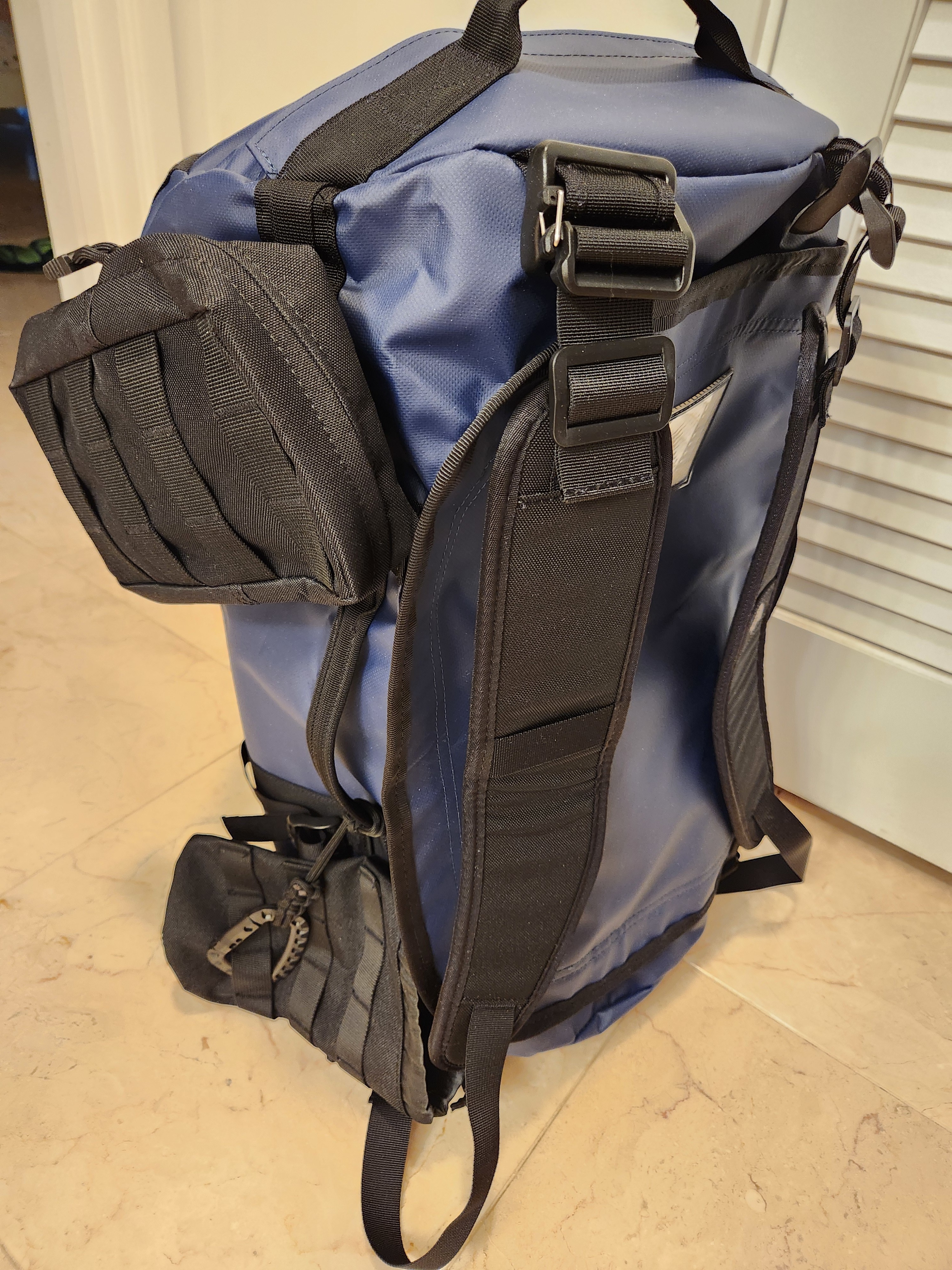 Added bottle holder and small accessories packs to side.