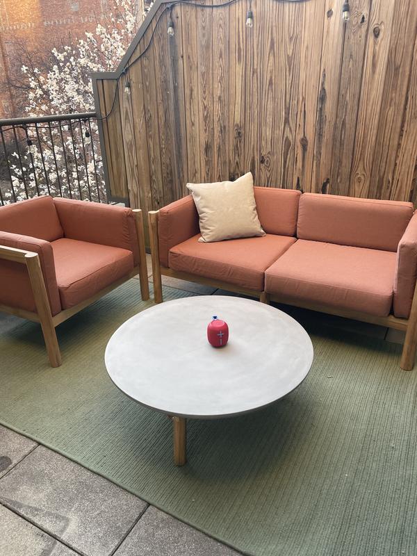 Loveseat, chair and round table with the sunbrella pillow