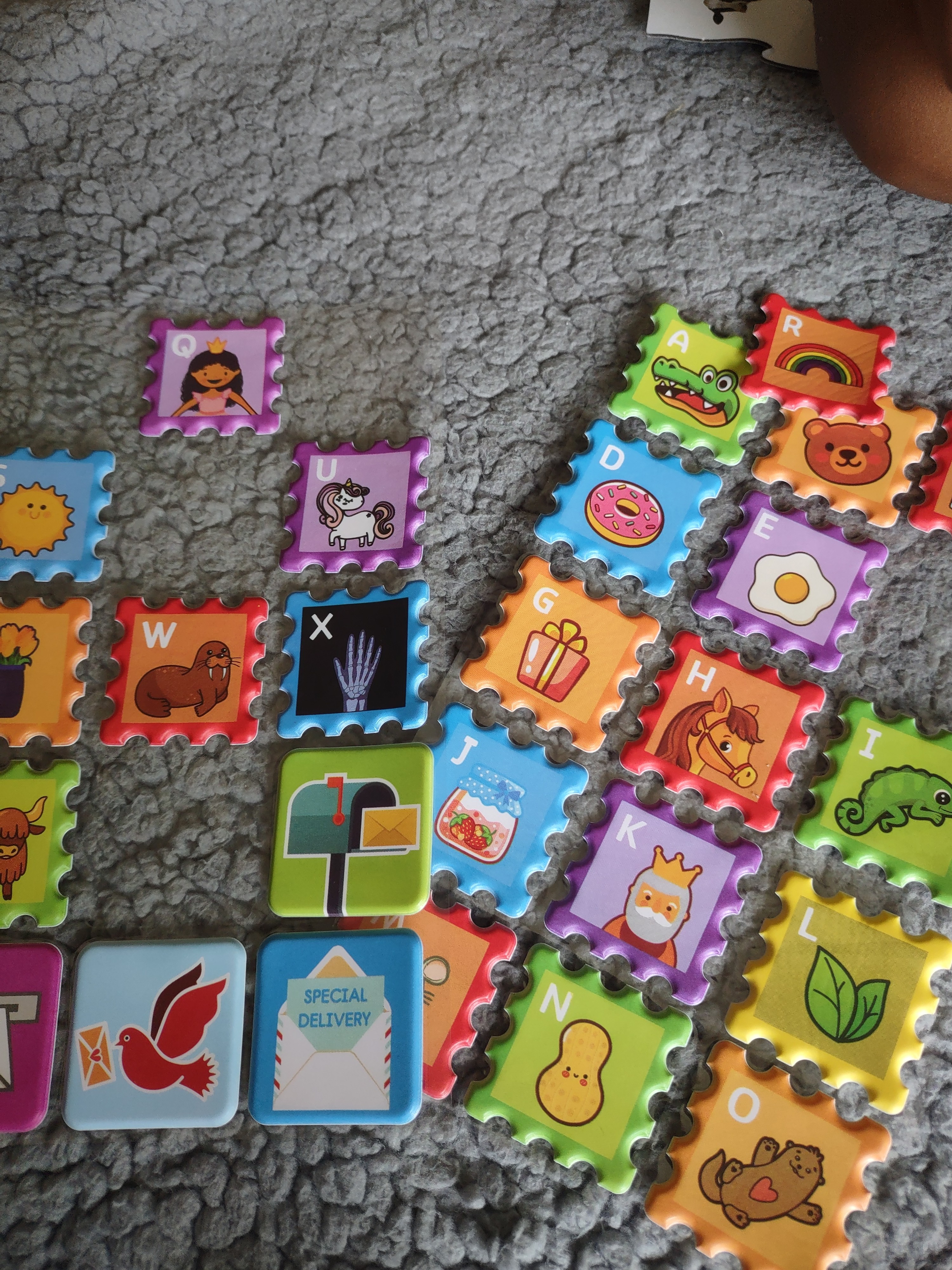 Colorful, reusable stamps for each letter in the alphabet including four additional stamps for postcards!