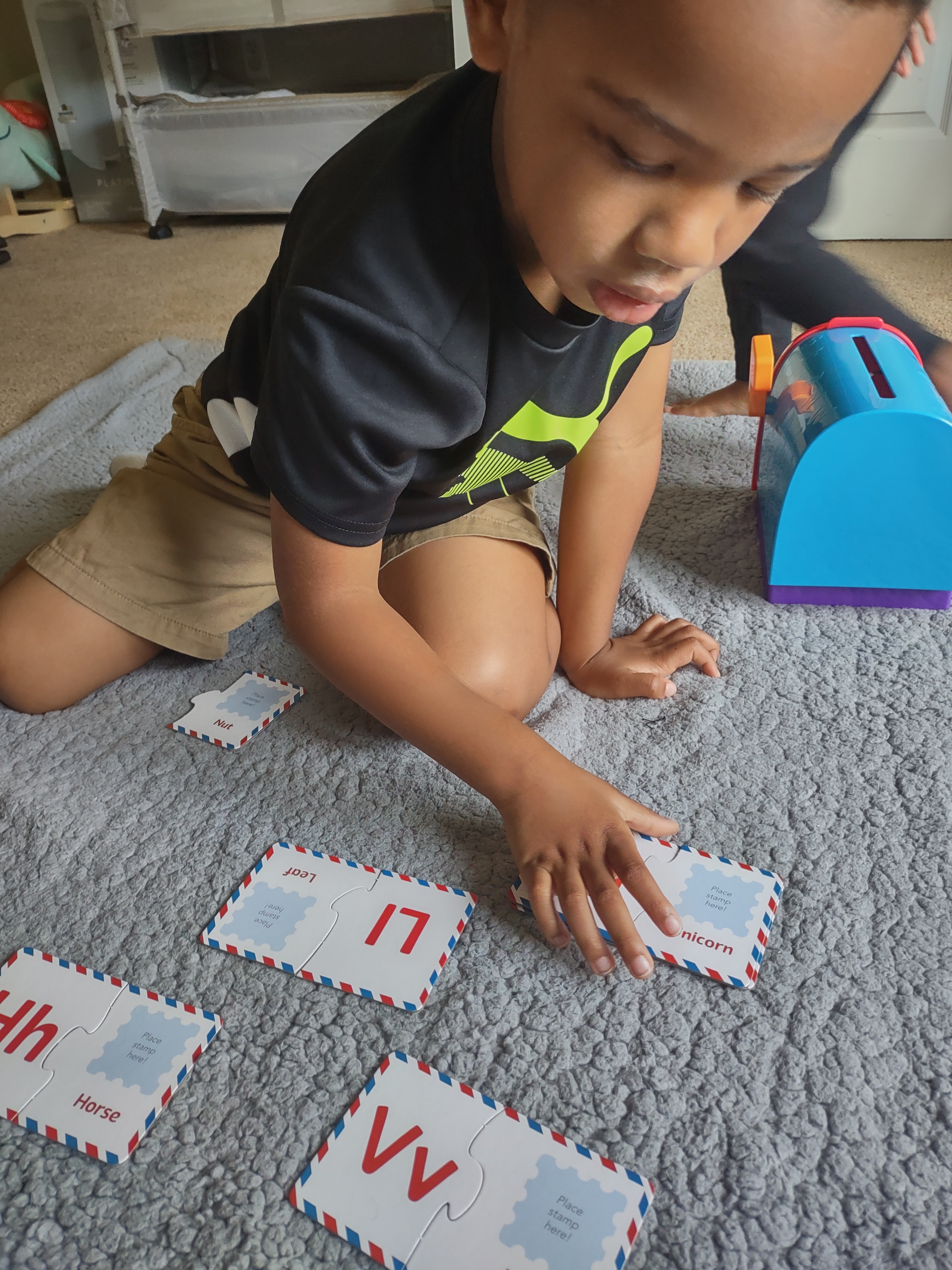 My 4 year old building the letter puzzles!