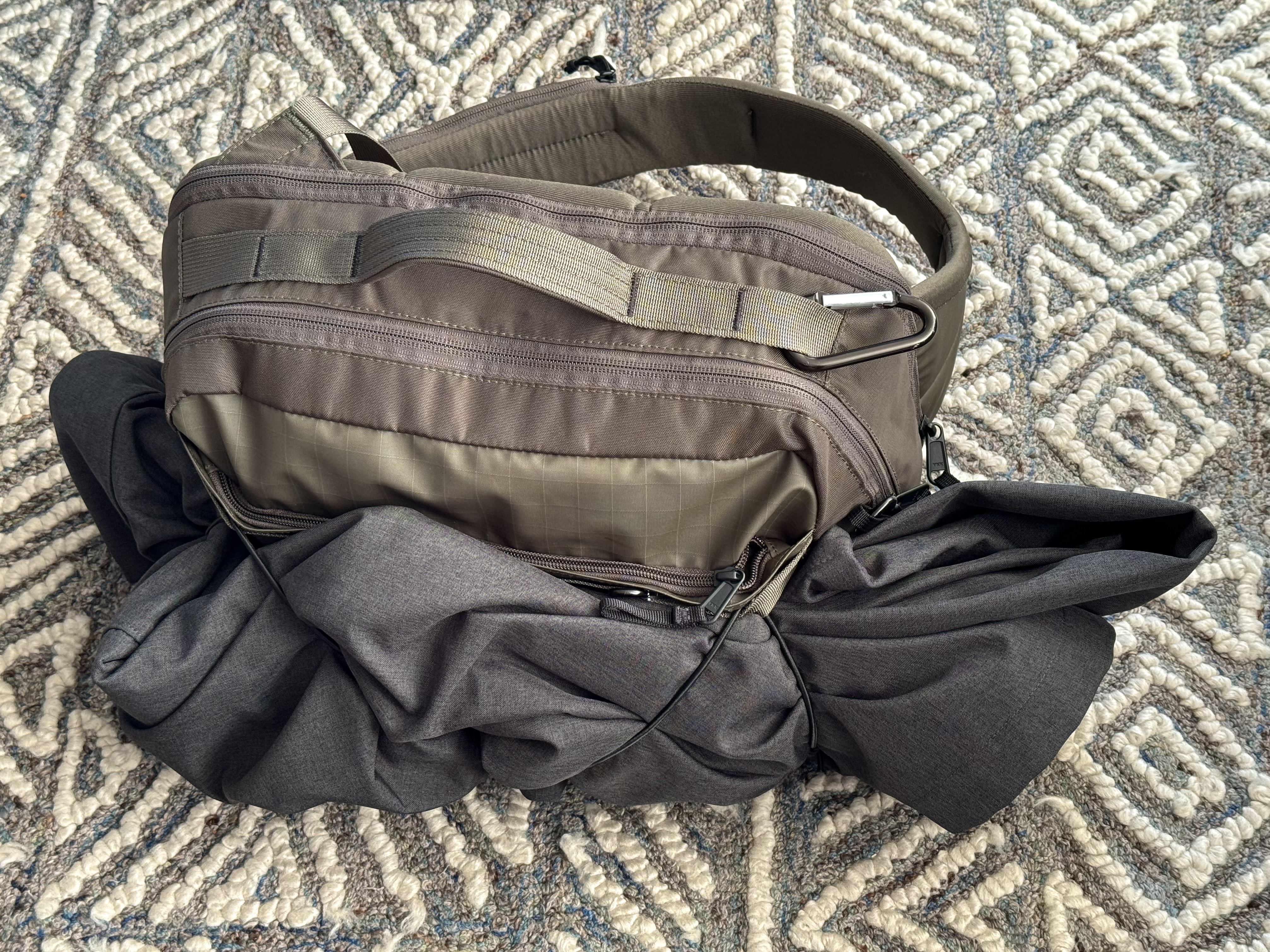 Bungees to hold an extra layer, wet umbrella or water bottle