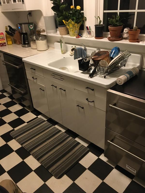 Cast iron sink between 2 sets of Thor refrigerator drawers