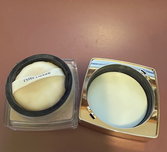 Cup is closed with puff in it.  Lid will screw back onto the container.