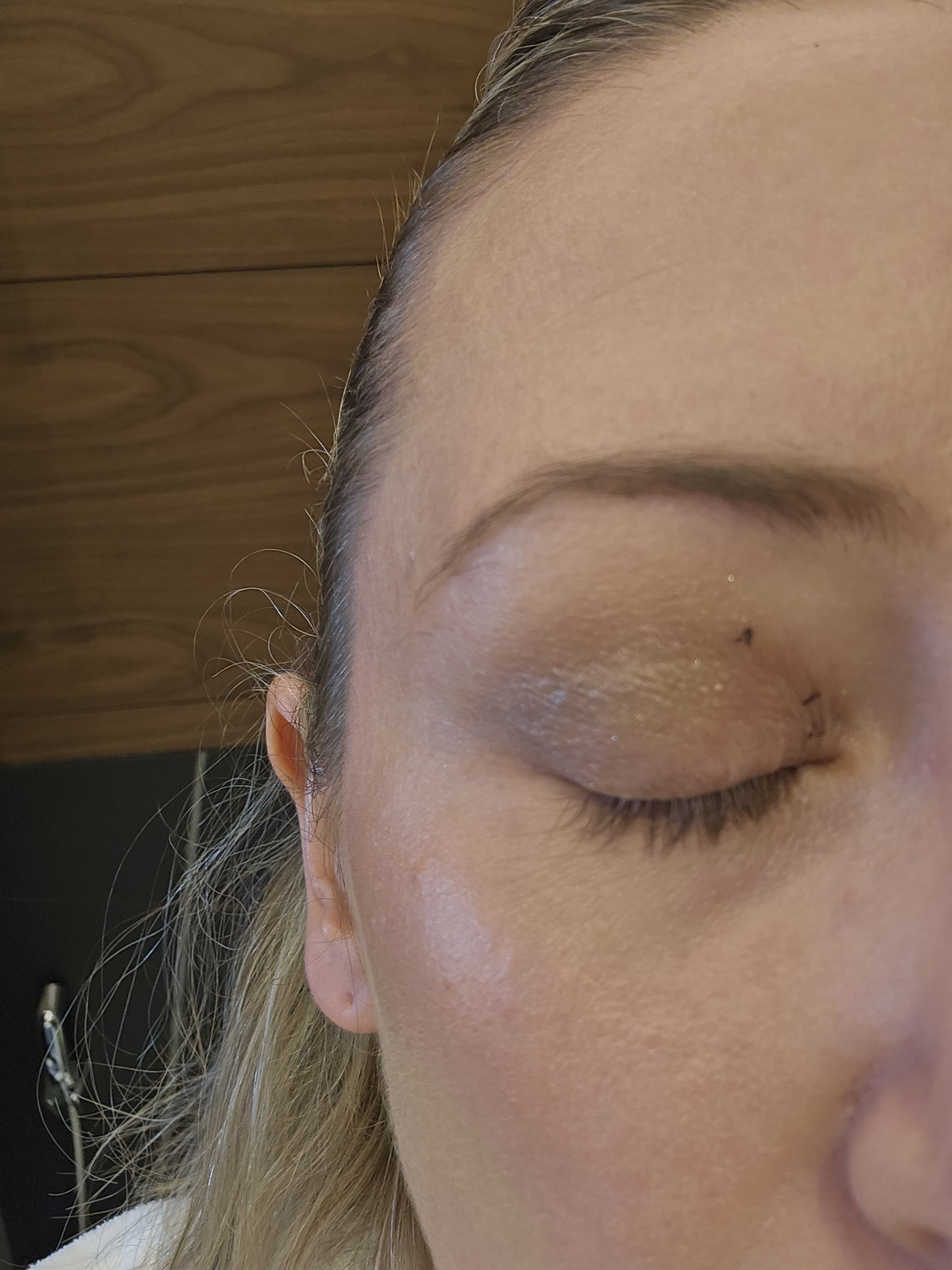 black plastic specks on my eyelid, everywhere I applied my foundation