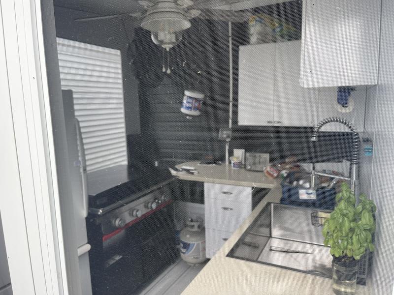 Screened in outdoor kitchen.
